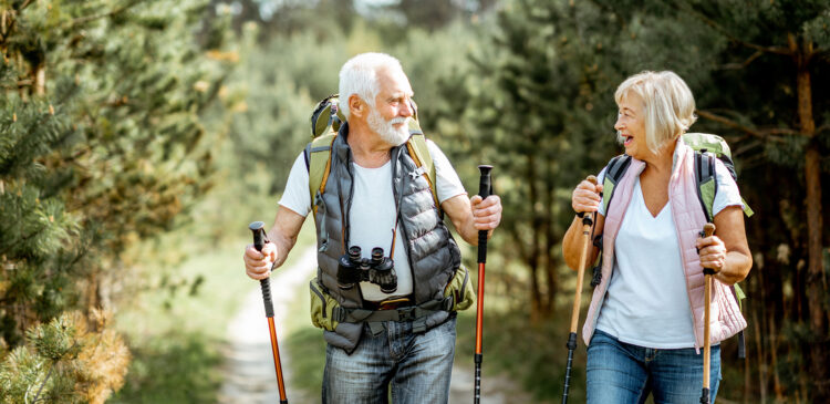 Happy Elderly going on a hike after having total joint replacement